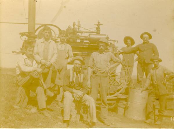Irving Bullock at far left with early tractor